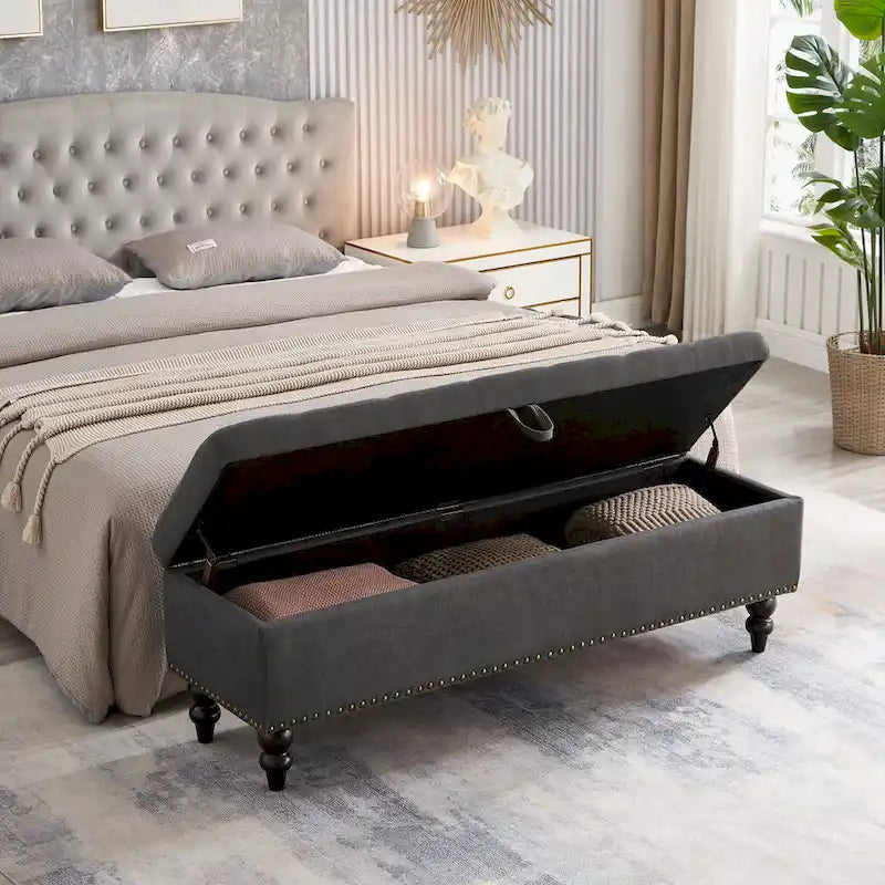 Banc de rangement recouvert de tissu souple, pieds en bois massif et clous en bronze