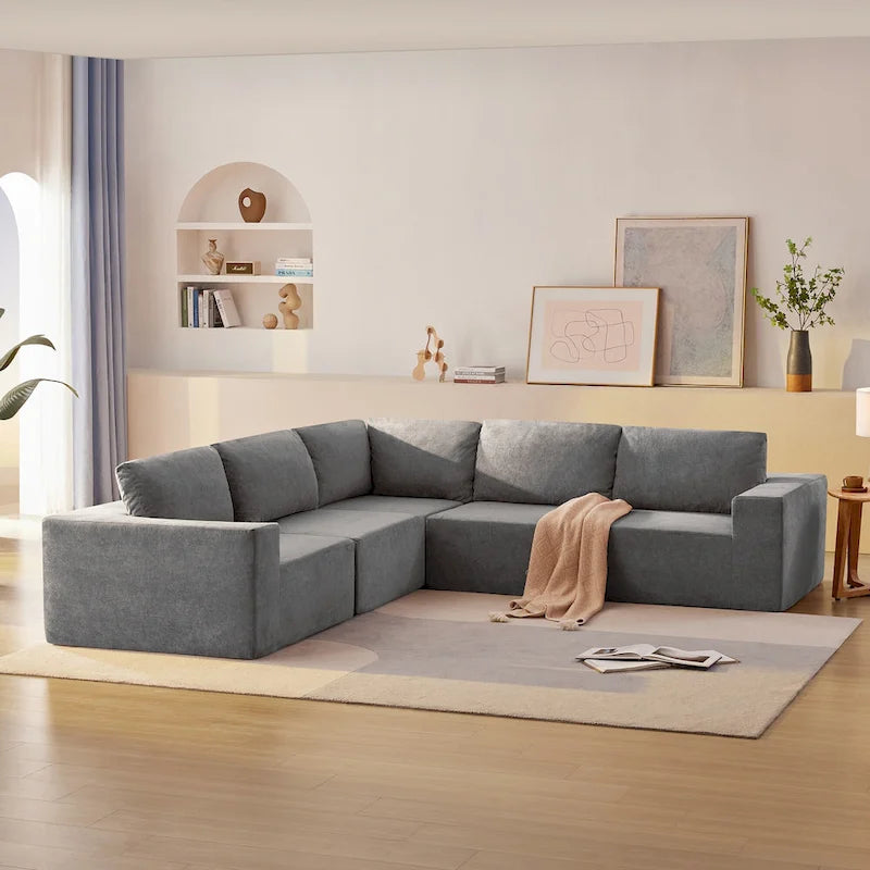 Canapé d'angle modulaire 5 places en forme de L gris 116 avec revêtement en tissu éponge moelleux pour un confort optimal dans le salon et la chambre.