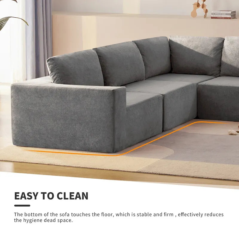Canapé d'angle modulaire 5 places en forme de L gris 116 avec revêtement en tissu éponge moelleux pour un confort optimal dans le salon et la chambre.