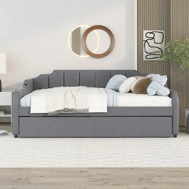 Lit de jour rembourré pleine grandeur avec lit gigogne et port de chargement USB. Le lit gigogne peut être déplié ou replié.