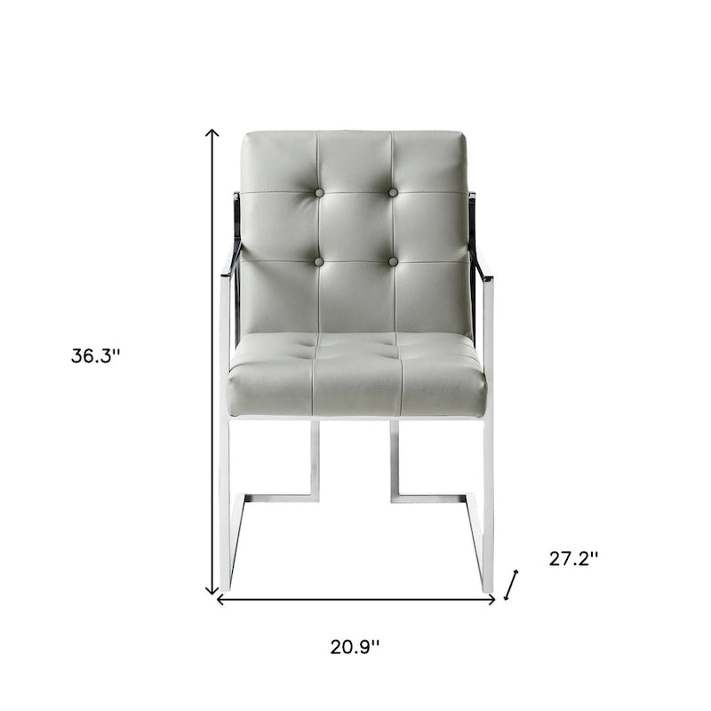 Ensemble de deux chaises de salle à manger HomeRoots capitonnées en similicuir gris clair et argent métallisé