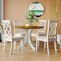 Ensemble de salle à manger rond 5 pièces en bois massif de style milieu du siècle, comprenant une table en noyer et des chaises beiges.