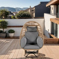 Fauteuil de jardin pivotant en rotin en forme d'œuf avec fonction bascule et coussins