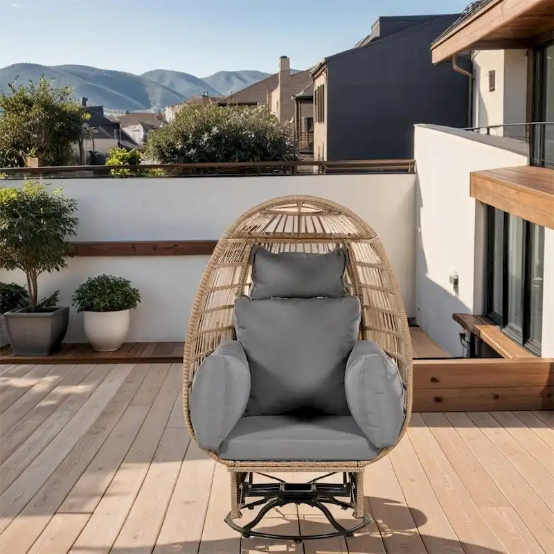 Fauteuil de jardin pivotant en rotin en forme d'œuf avec fonction bascule et coussins