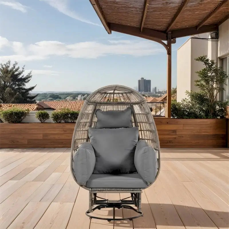 Fauteuil de jardin pivotant en rotin en forme d'œuf avec fonction bascule et coussins