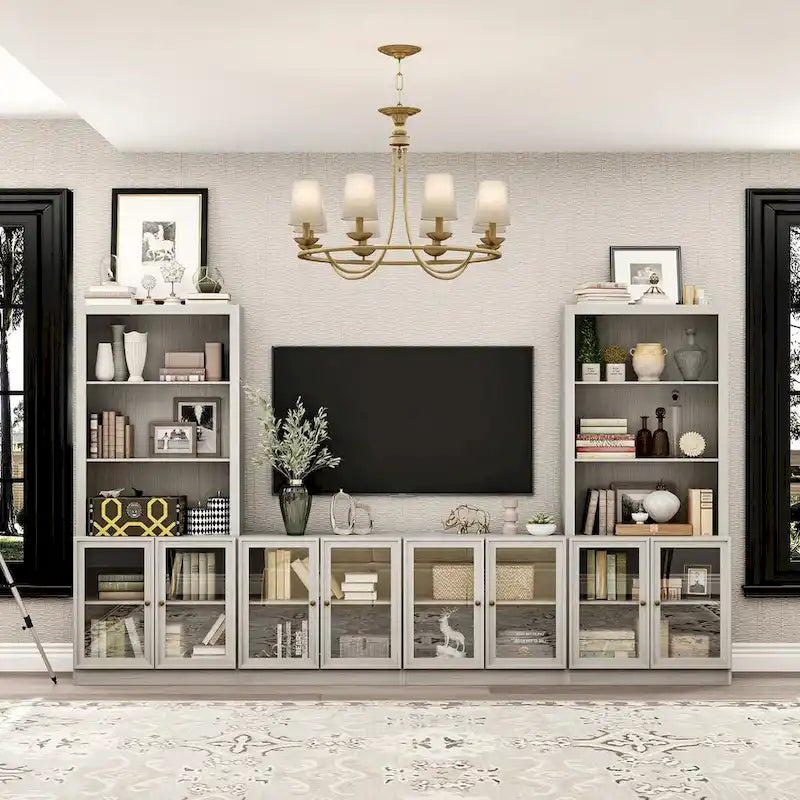 Meuble multimédia à domicile au design élégant, avec de nombreuses étagères et des accents de verre.